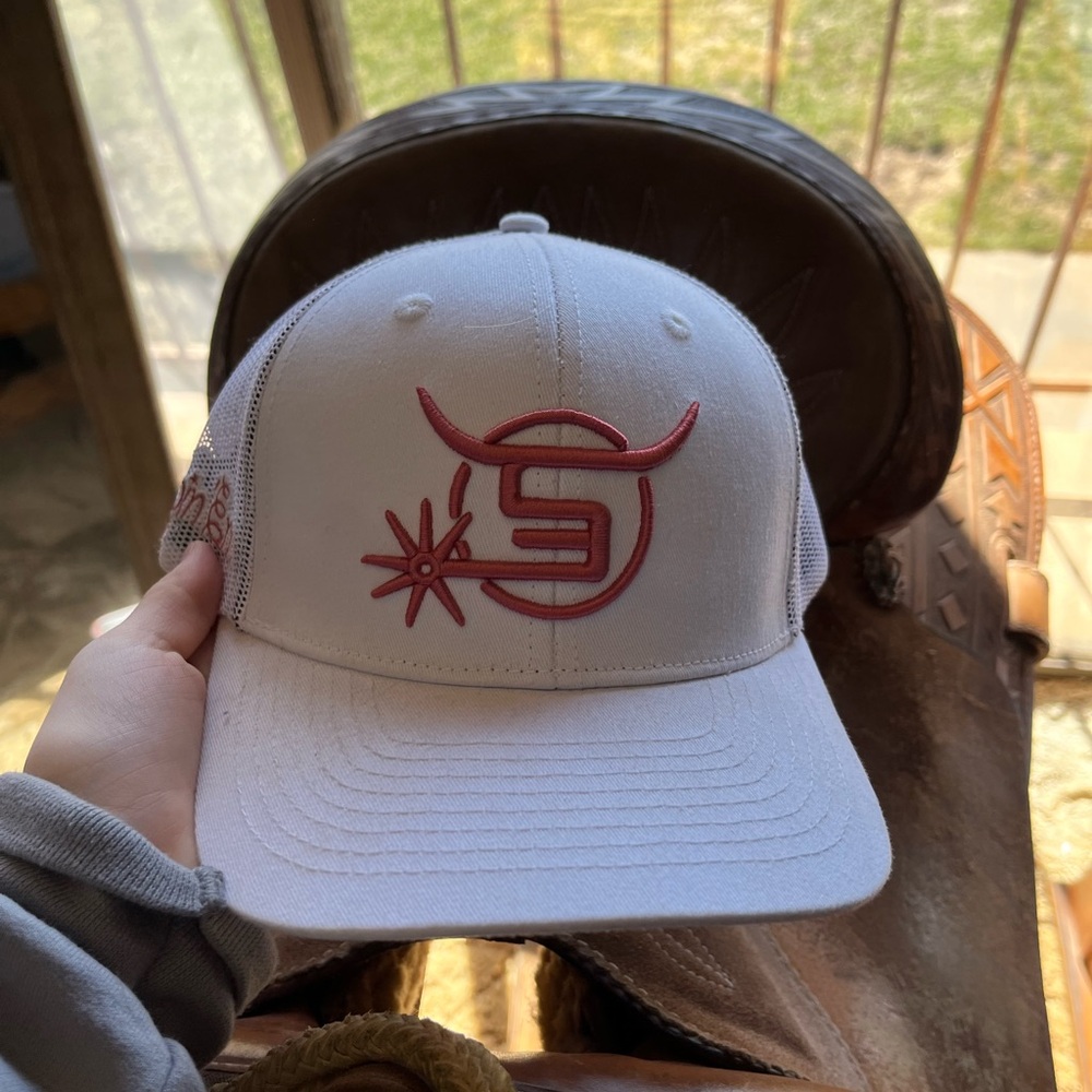 White and reddish hat, barely worn